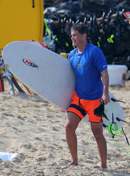 Surfing into the New Year: Rob Lowe was one of the active stars to opt for a Hawaiian 2015